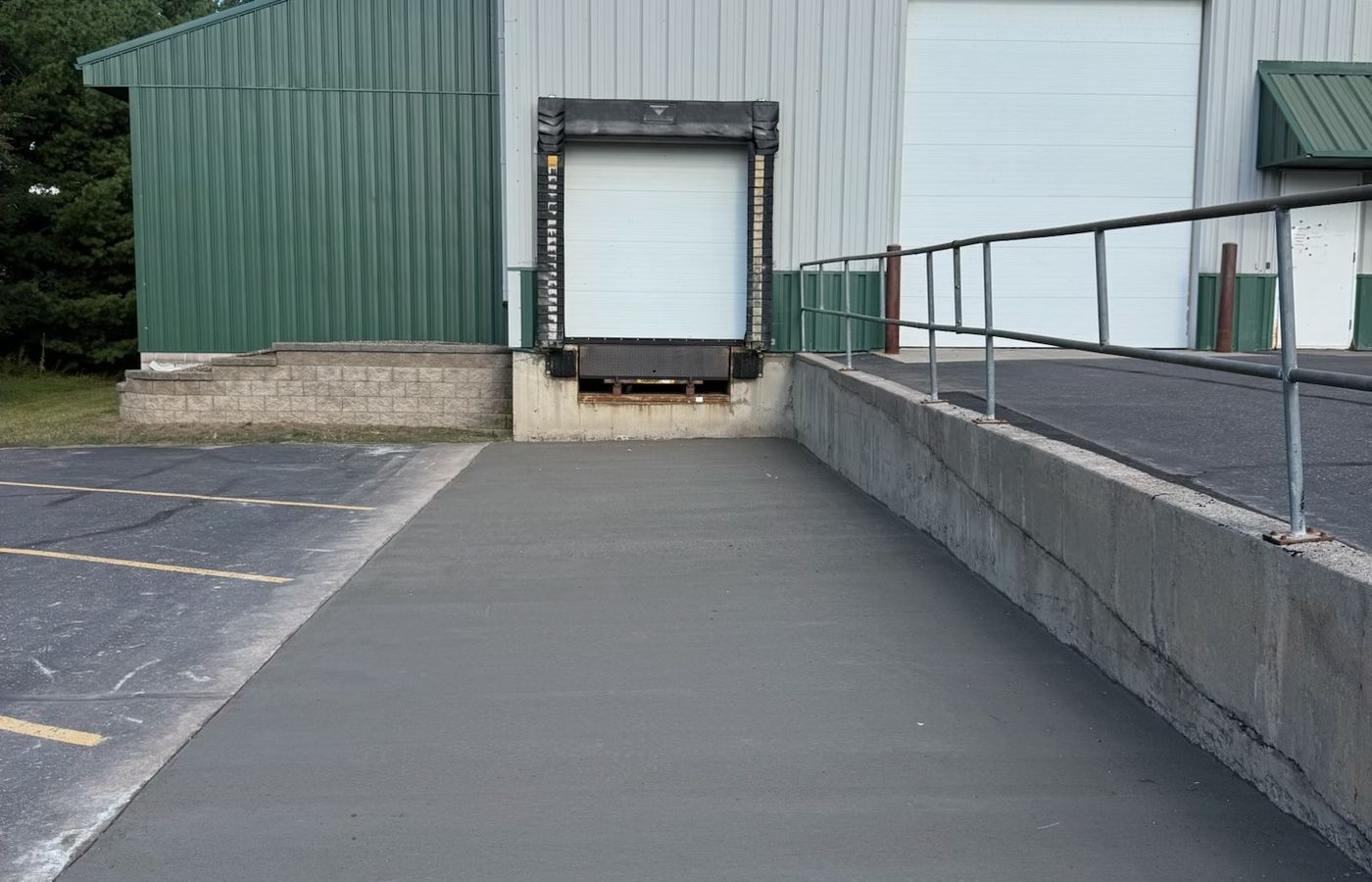 Poured concrete loading dock apron in a parking lot