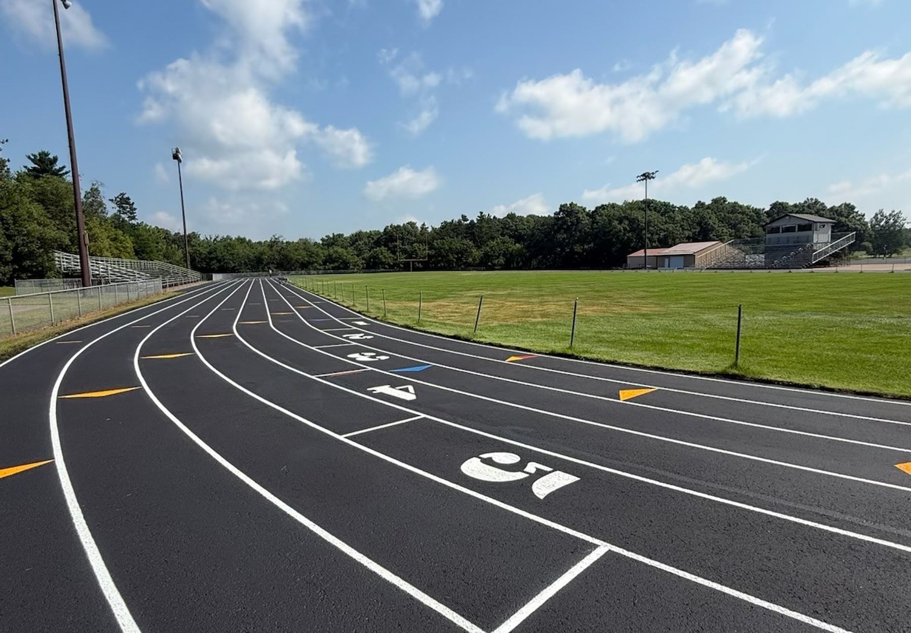 Resurfaced running track with measured lanes and exchange zones